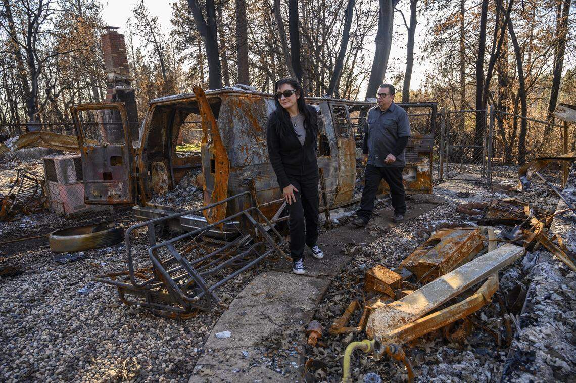 Campfire victims Lisa Butcher and Randy Viehmeyer say they still can’t think where to go because they still need to mourn their loss at the site where they lived in Paradise on Thursday, Jan. 24, 2019 in Paradise, Calif. “Its like a death, death of a town, death of all your memories, death of some people pets,” said Viehmeyer as he looked for his lost cat. The couple return often to feed birds, squirrels and the cats that remain in the area.