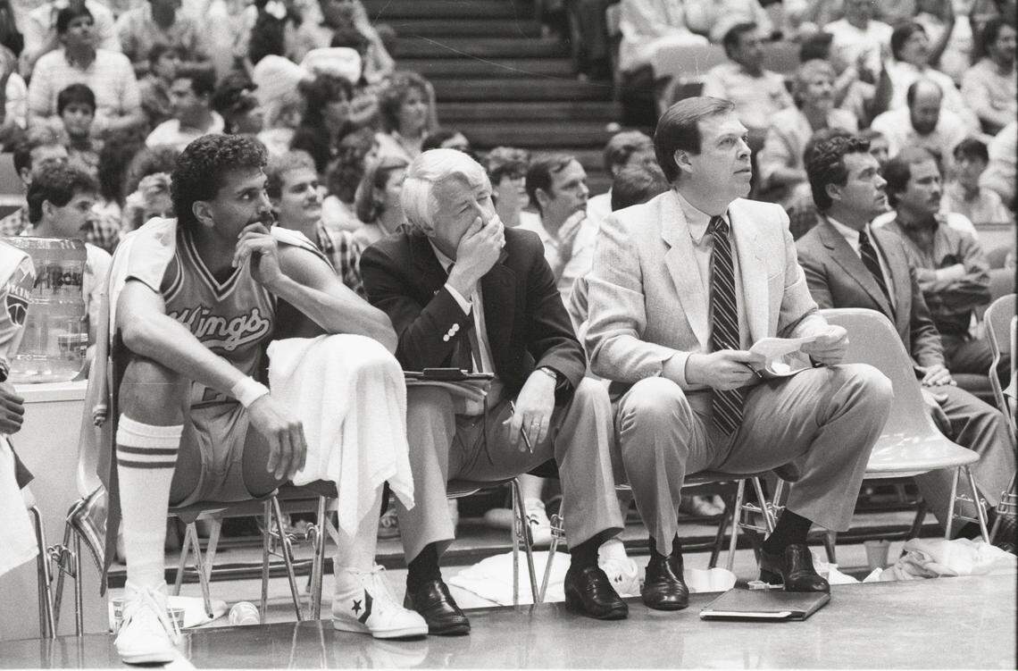 Sacramento Kings guard Reggie Theus and assistant coaches Jerry Reynolds and Frank Hamblen watch the Game 2 playoff loss to the Houston Rockets in Texas on April 19, 1986.