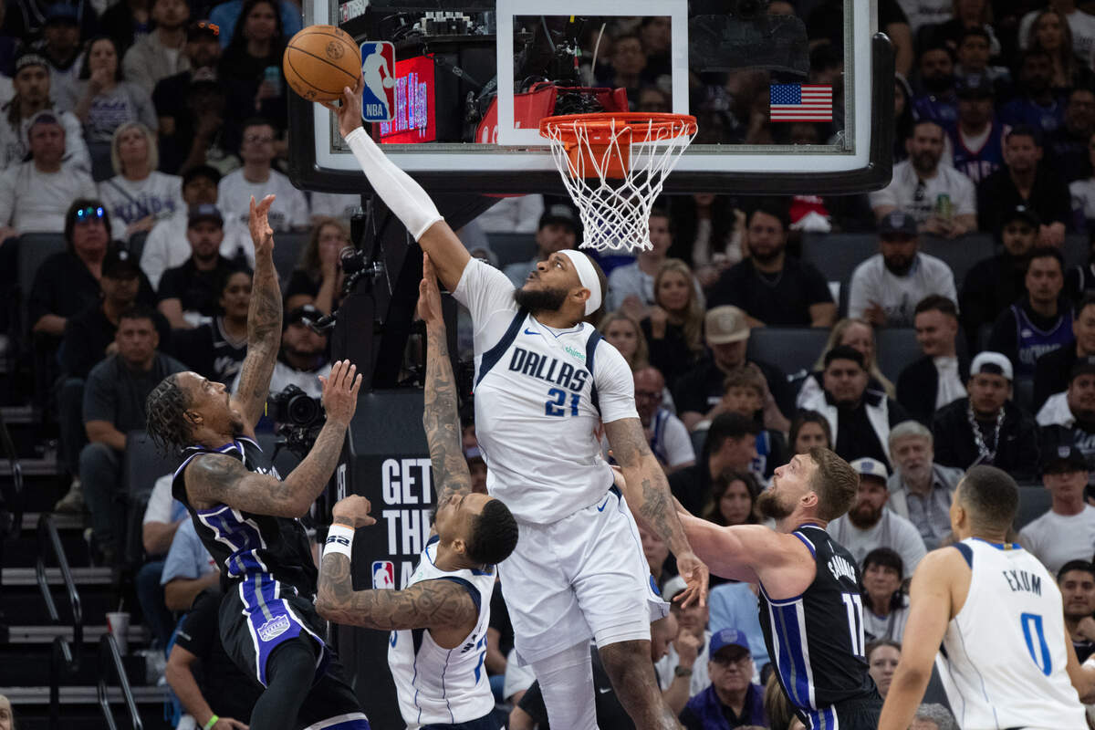 Dallas Mavericks center Daniel Gafford (21) blocks a shot by Sacramento Kings forward DeMar DeRozan (10) during an NBA play-in game at Golden 1 Center on Wednesday.
