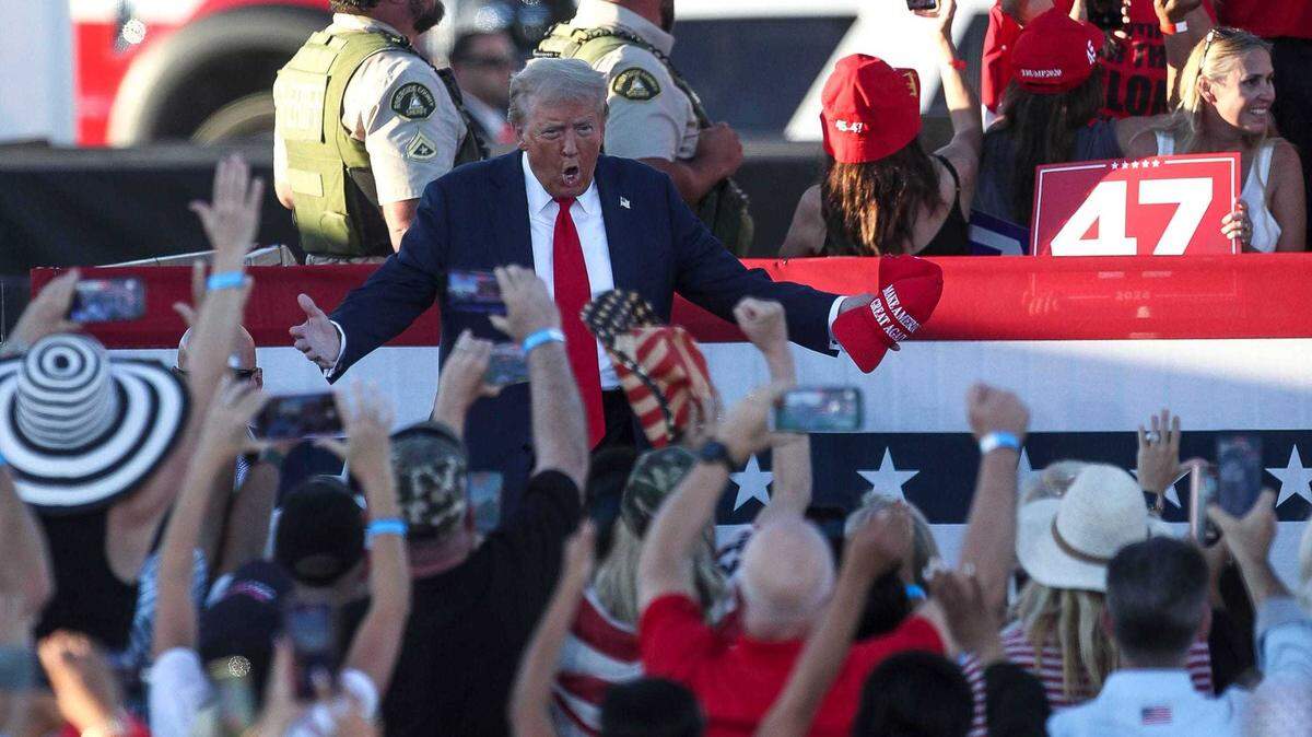 Donald Trump takes the stage during a rally in October.