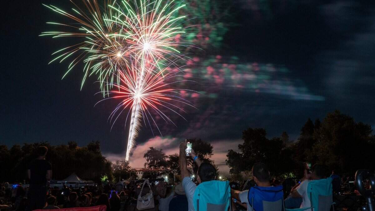 Fireworks explode illuminate the skyline over Hagen Park in Rancho Cordova on Wednesday, July 3, 2024, during the city’s Fourth of July celebration.