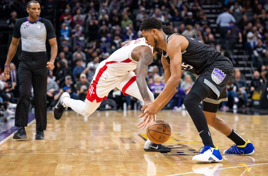 Sacramento Kings guard/forward PJ Dozier (35) steals the ball from Houston Rockets forward Tari Eason (17) during the fourth quarter of the NBA basketball game Wednesday, Jan. 11, 2023, at Golden 1 Center in Sacramento. The Kings beat the Rockets, 135-115.