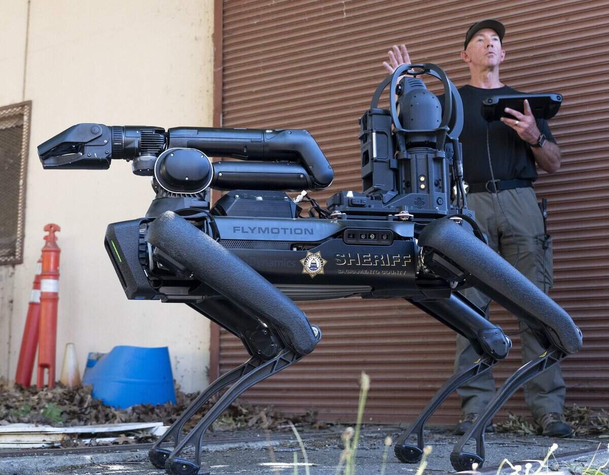 Sacramento County Sheriff’s Lt. Tom McCue demonstrates the office’s new robot dog, Buster, on Tuesday. The robot will be operated by the sheriff’s office bomb squad.