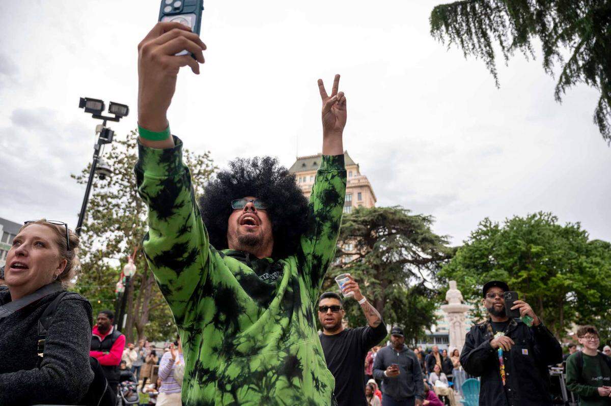 Martin Ortiz takes a selfie while at the opening night of the Concert in the Park series on Cinco de Mayo on Friday, May 5, 2023, at Cesar Chavez Plaza.