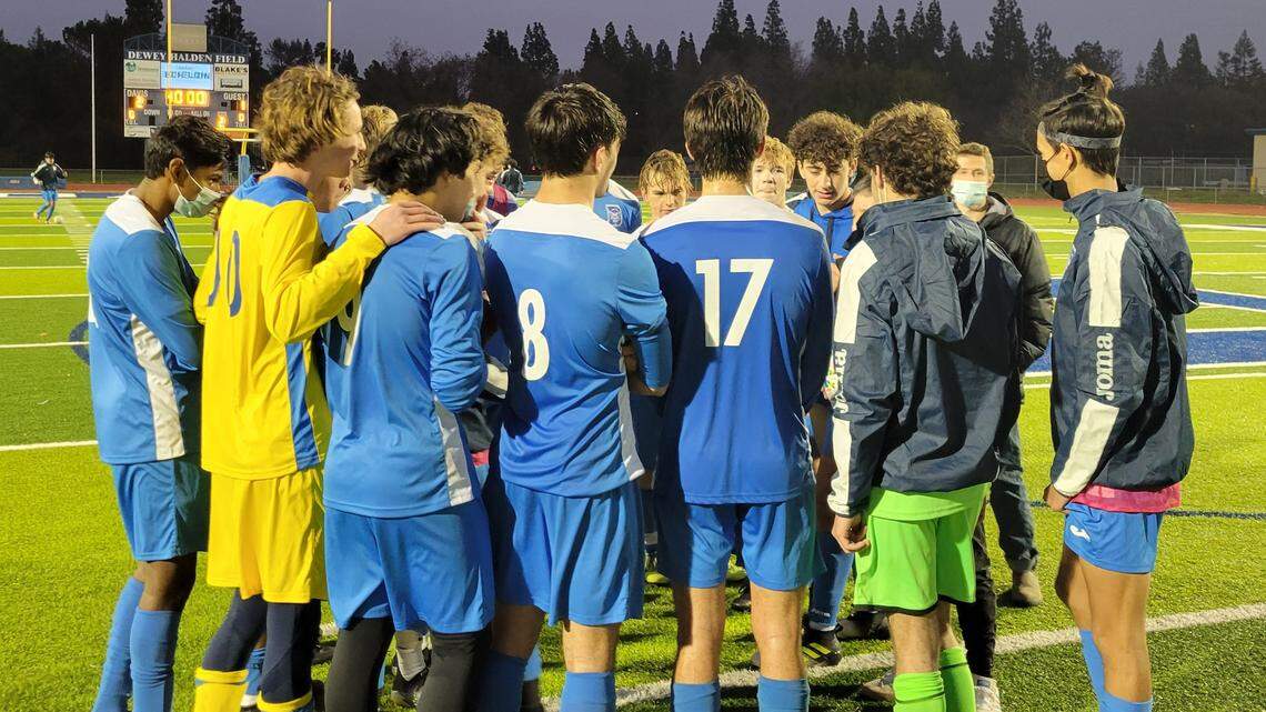 Davis boys’ soccer players celebrate after their 2-1 win over Jesuit on Thursday, Jan. 6, 2022.