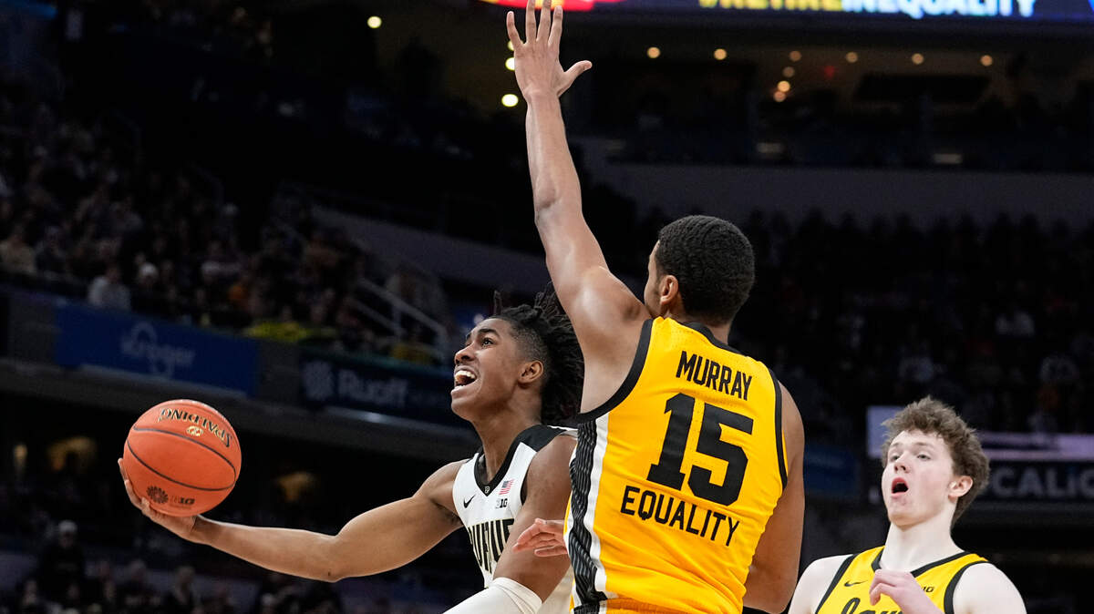 Purdue guard Jaden Ivey drives to the basket ahead of Iowa forward Keegan Murray (15) and center Riley Mulvey (44) during the first half of an NCAA college basketball game at the Big Ten Conference tournament, Sunday, March 13, 2022, in Indianapolis. (AP Photo/Darron Cummings)