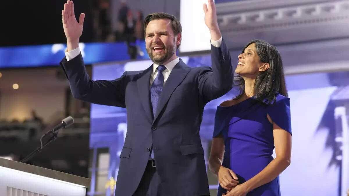 Vice presidential candidate J.D. Vance stands on stage with his wife, Usha, at the 2024 Republican National Convention. The two met while studying at Yale Law School.