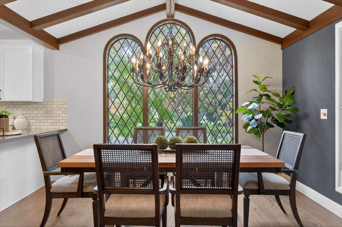 There are elegant living and dining rooms featuring two fireplaces for inviting gatherings.