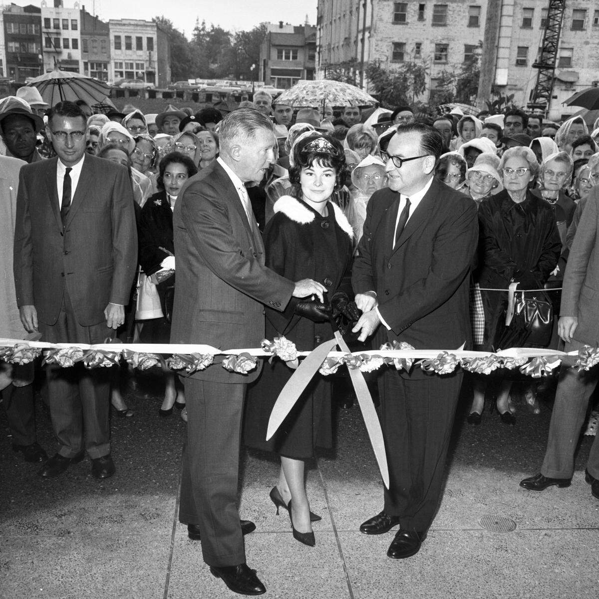 Macy’s executive Ernest Molloy, left, Miss California Wendy Douglas and Gov. Pat Brown cut the ribbon at the Macy’s grand opening in downtown Sacramento on Nov. 4, 1963.