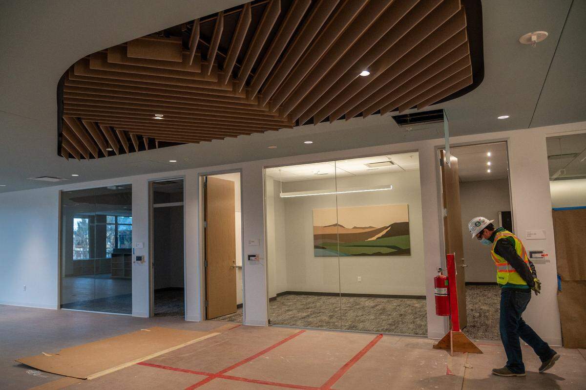 Eric Ertman, senior construction manager with AECOM, walks toward the Lake Elsinore conference room on the third floor of the building on Thursday.