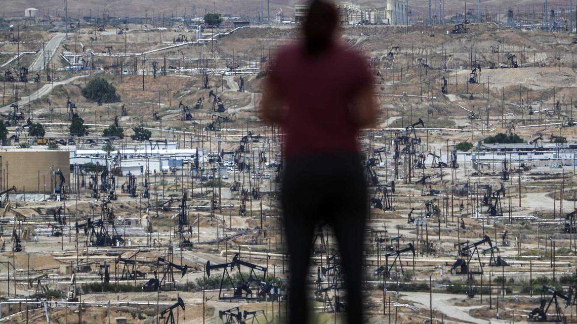 A person looks over the immense Chevron Kern River Oil Field from the Panorama Bluffs in Bakersfield in 2023.