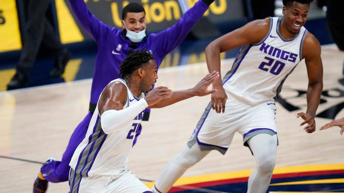 Sacramento’s Buddy Hield runs off the court as teammates pursue him after he scored the winning basket in overtime against the Denver Nuggets on Wednesday.