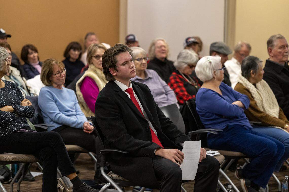 Garrett Culp, the president of Club America at Twelve Bridges High School, listens to speakers at the Lincoln City Council meeting on Tuesday.