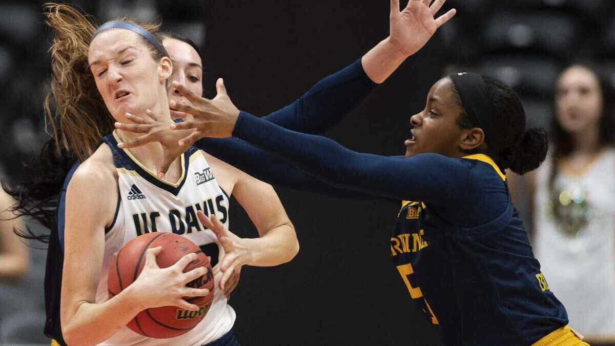 Morgan Bertsch #22 of the UC Davis Aggies grabs a rebound in front of Sabrina Engelstad #33 and Brooke Bayman #5, both of the UC Irvine Anteaters in the semifinals of the Big West Women’s Tournament at Honda Center in Anaheim on Friday, March 15, 2019. UC Davis defeated UC Irvine 82-50. (Photo by Kevin Sullivan, Orange County Register/SCNG)