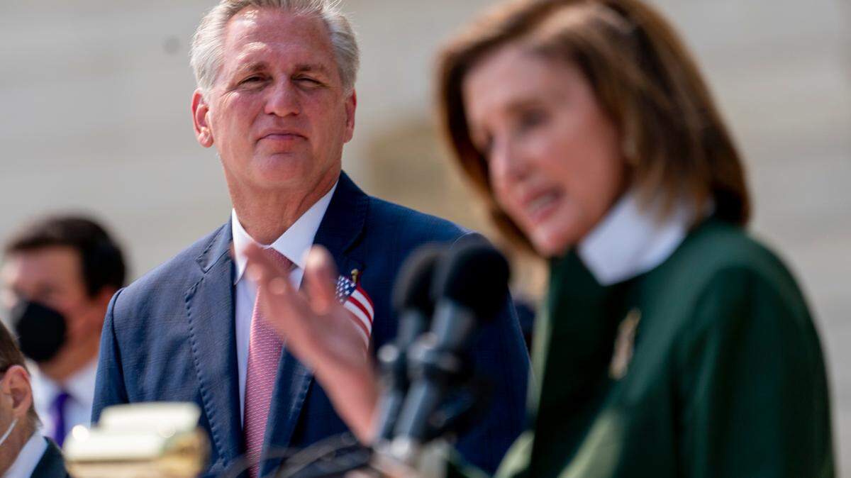 House Speaker Nancy Pelosi of Calif., right, accompanied by House Minority Leader Kevin McCarthy of Calif., left, speaks during a Congressional Remembrance Ceremony marking the 20th anniversary of the Sept. 11, 2001, terrorist attacks, on Capitol Hill in Washington, Monday, Sept. 13, 2021. (AP Photo/Andrew Harnik)