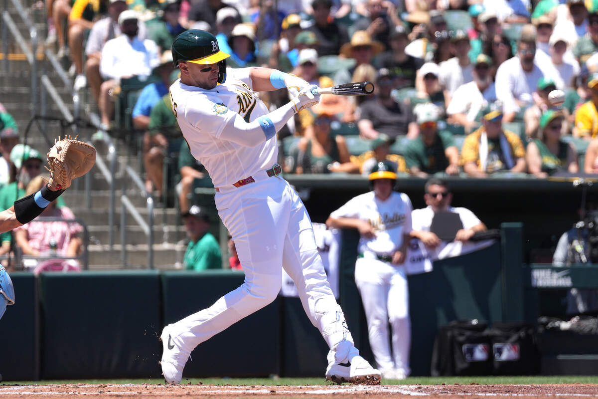 Joey Meneses (13) of the Athletics hits an RBI single scoring Jacob Wilson (5) against the Los Angeles Angels in the bottom of the first inning at Sutter Health Park on June 21 in West Sacramento. Meneses was recalled Friday.