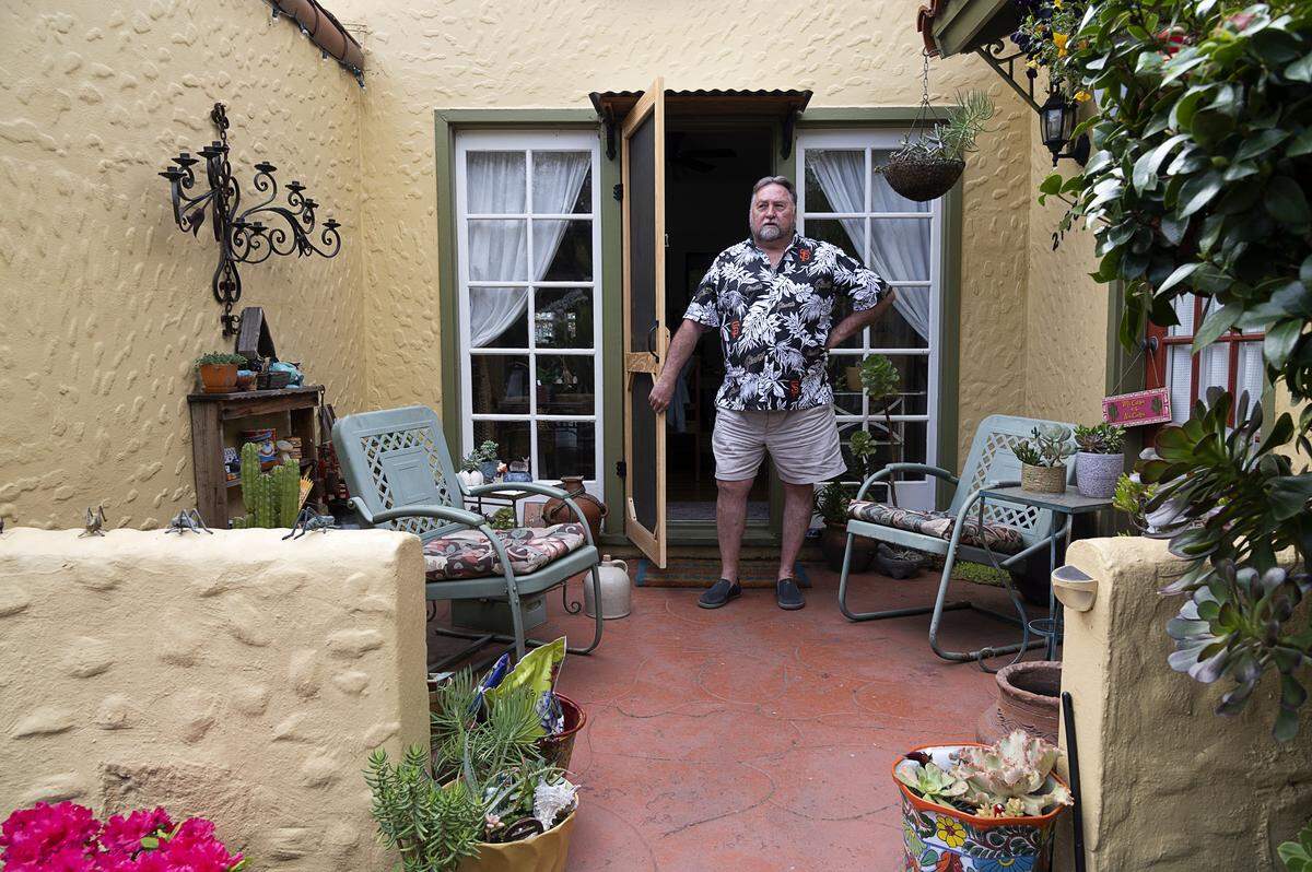 Lauren Lundsten, 71, owner of Swanbergs, a tropical-themed boutique on J Street, has closed his store during the coronavirus outbreak and is staying home with his wife on Tuesday, March 24, 2020, in Sacramento.