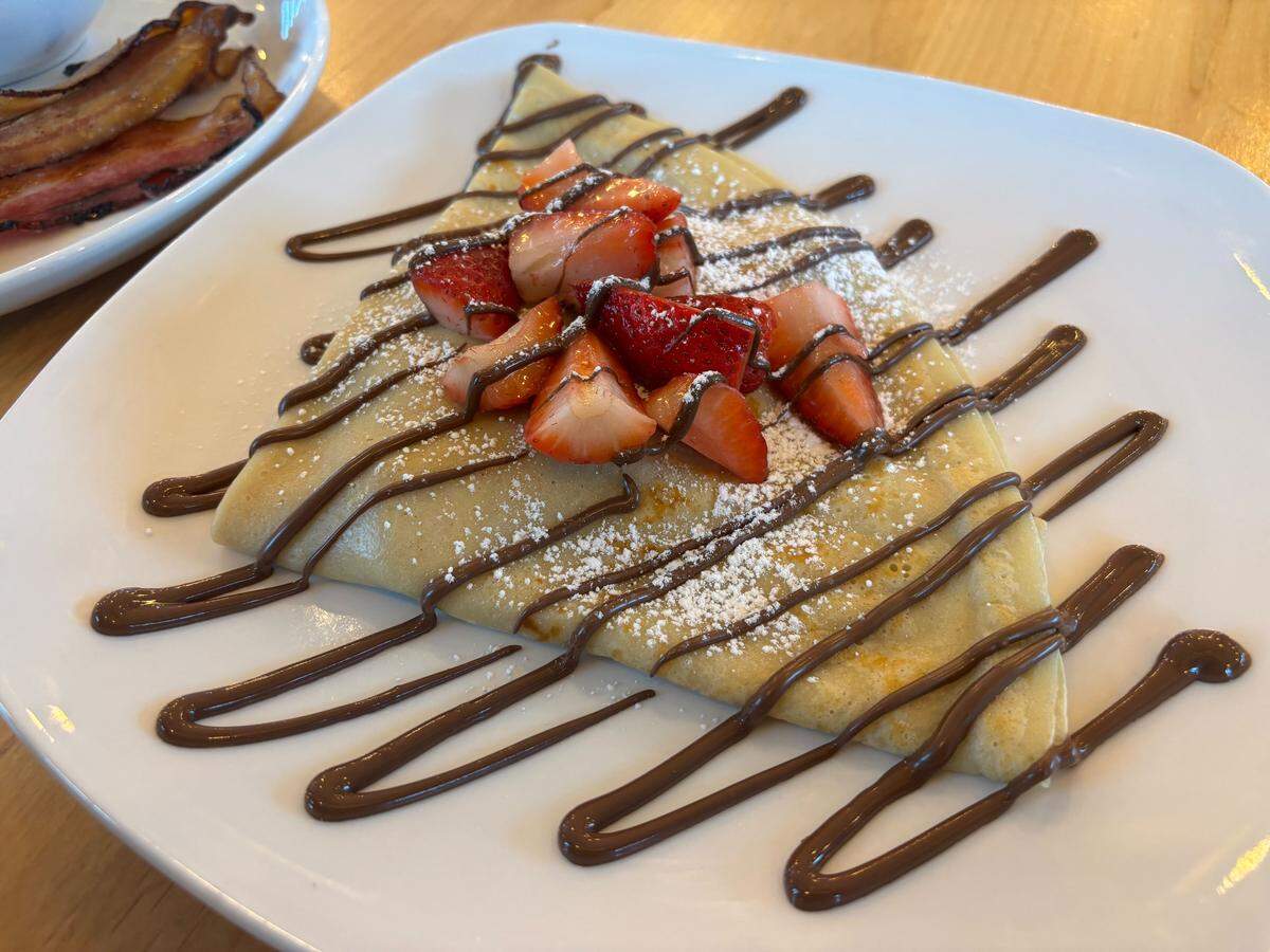 The MoJoeJoeJoe crepe at MoJoe’s Cafe in Roseville neatly wraps strawberries and Nutella in an airy crepe and is topped with cut strawberries and drizzled with more Nutella.
