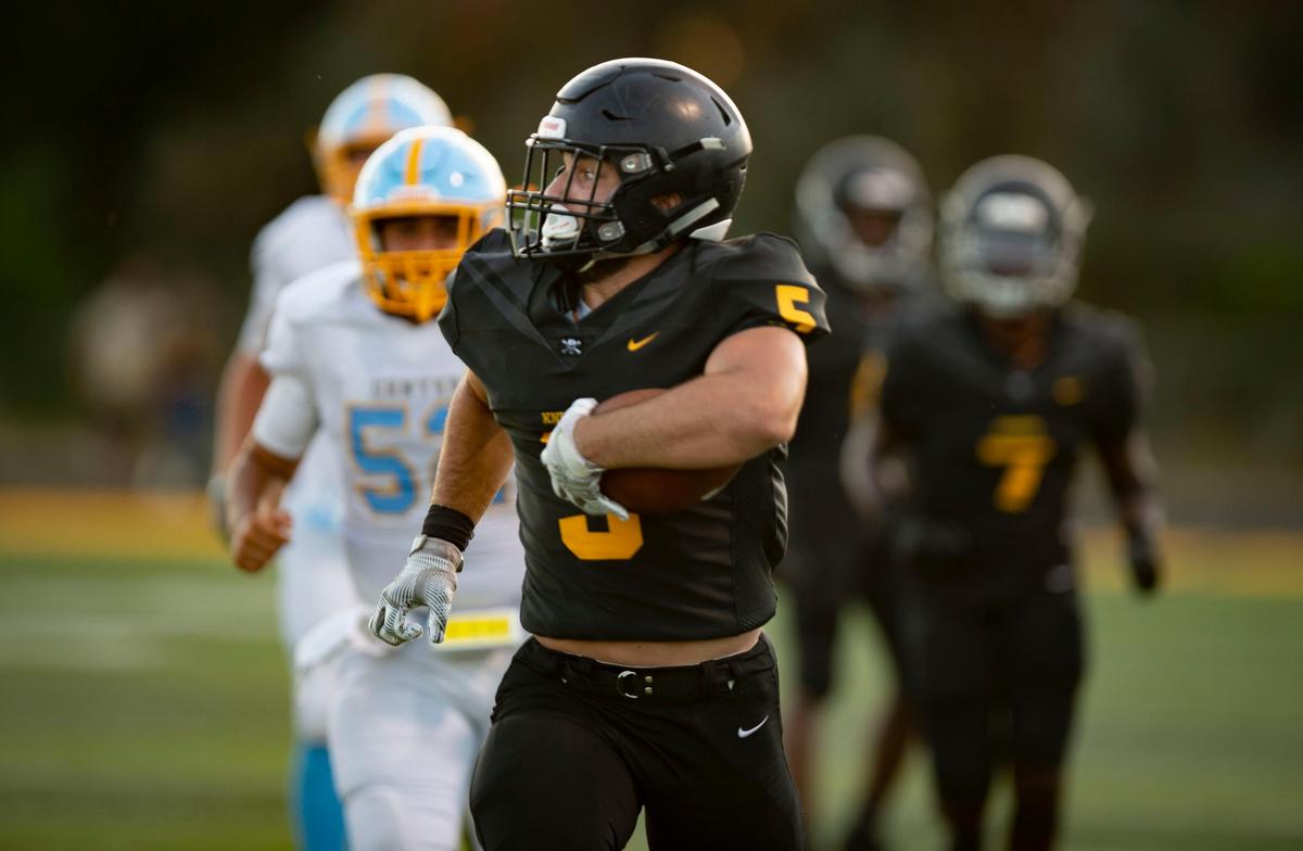 Rio Linda’s Cameron Skattebo looks for defenders during Center’s 48-40 win Friday night, Aug. 23, 2019.