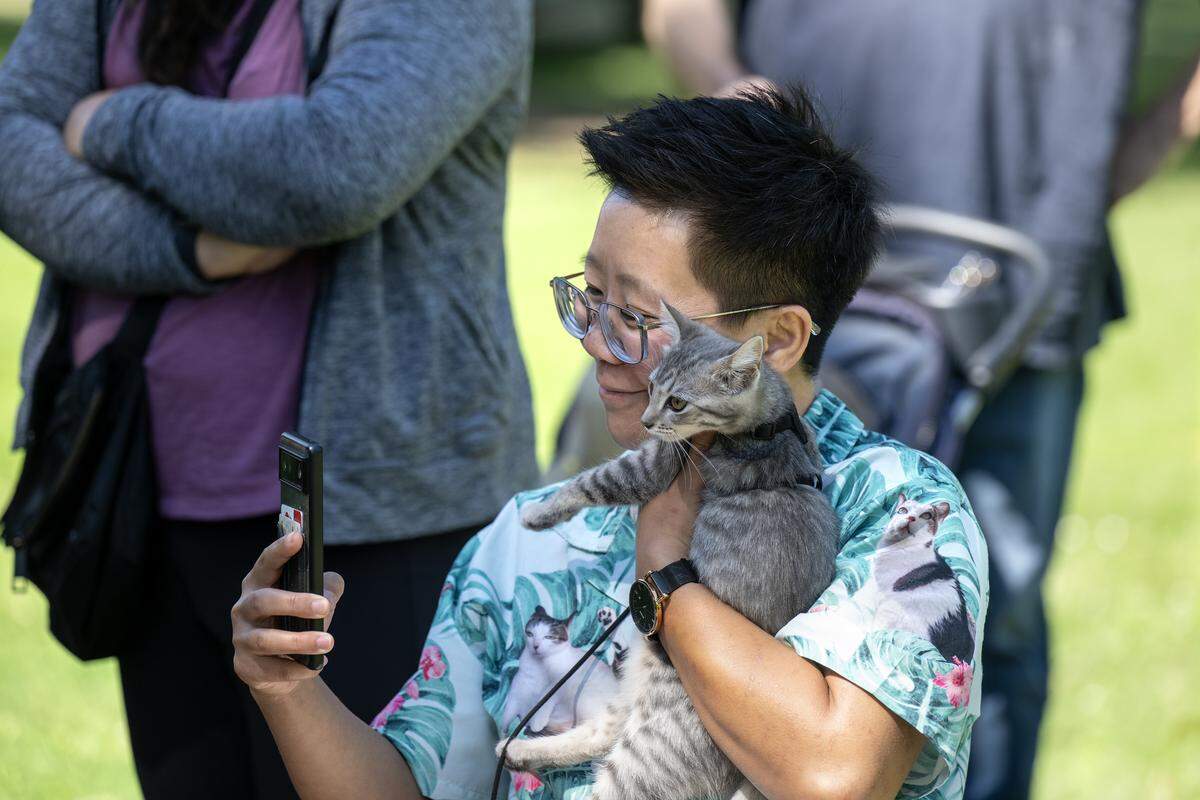 Danielle Keaton take a selfie with her new friend Spicy Sage during Saturday’s Caturday event in Land Park. 