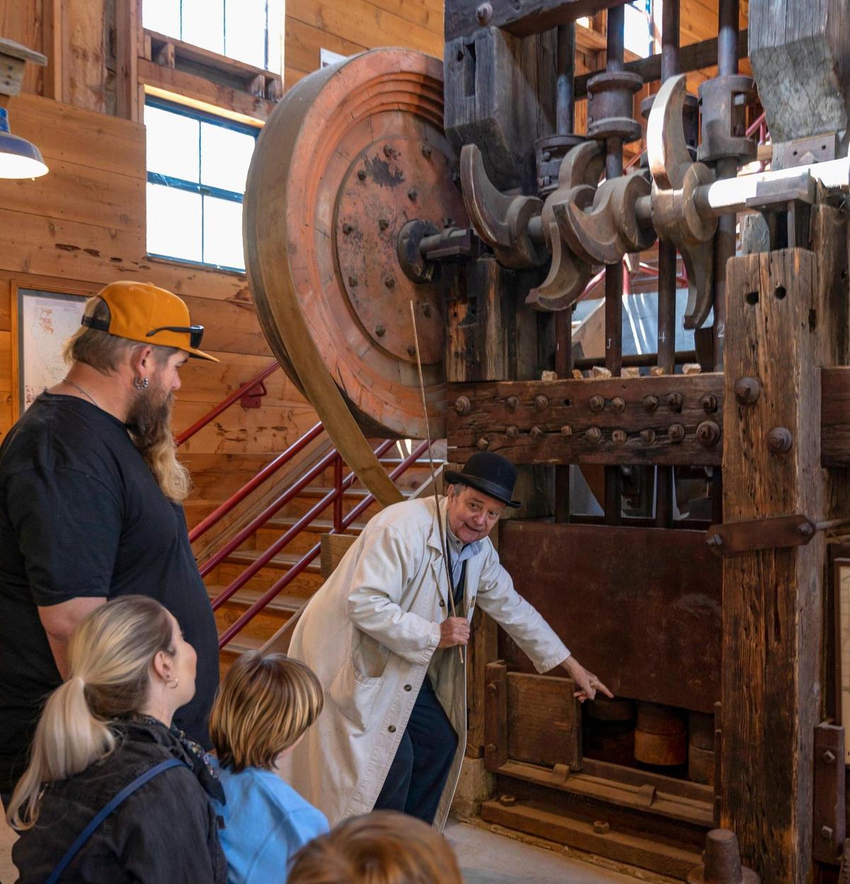 Docent Keith Gibbs explains how a stamp mill extracted gold from ore at Gold Bug Park and Mine in Placerville earlier this month. This stamp mill was in use from 1900 to 1936.
