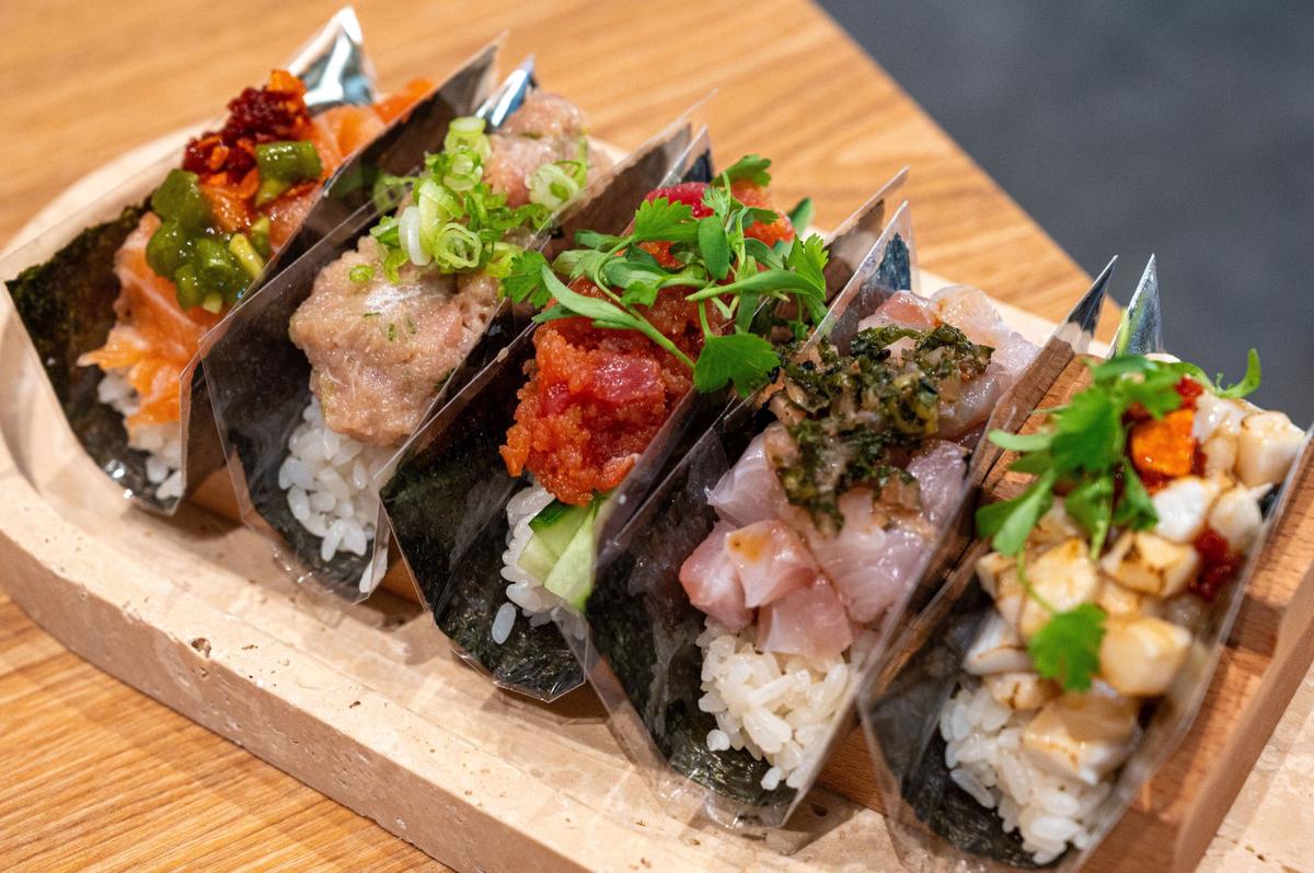 A set of five hand rolls is served at Hello Temaki in Elk Grove on July 25. The rolls contain salmon, spicy tuna, yellowtail, kanpachi and escolar.