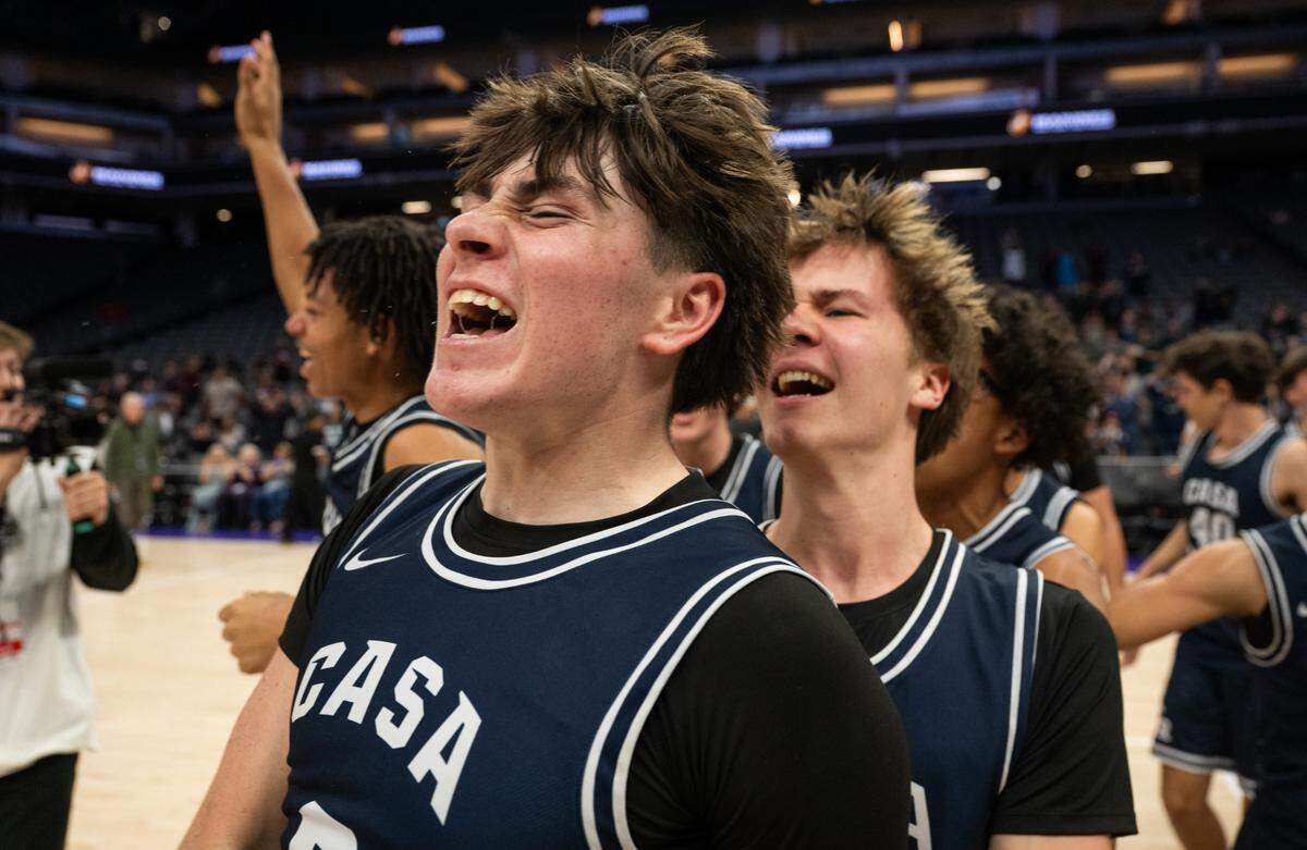 Casa Roble Rams guard Ace Villegas (0) celebrates with his teammates after they defeated the Natomas Nighthawks for the CIF Sac-Joaquin Section Division IV boys basketball championship at Golden 1 Center on Thursday.