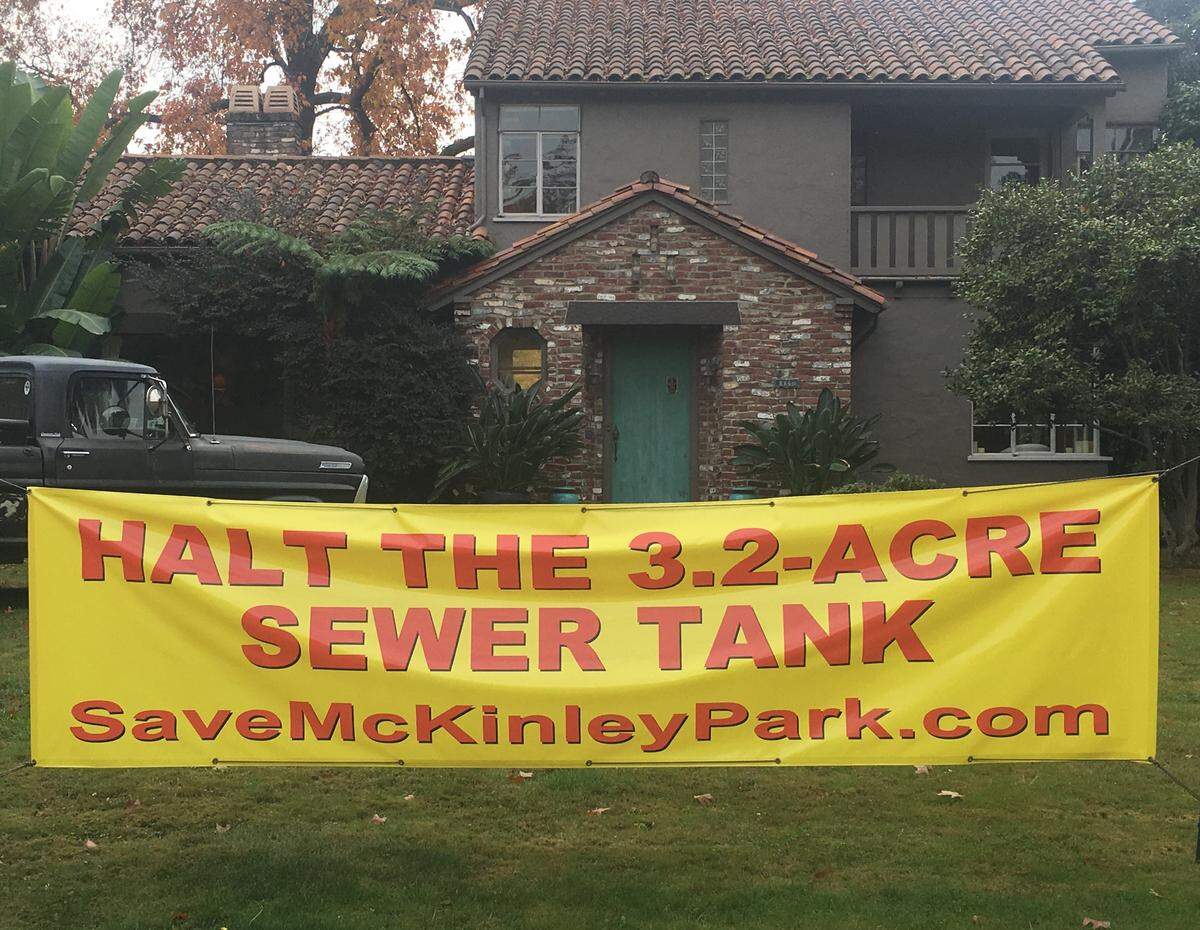 A sign sits outside a home near McKinley Park in East Sacramento on Nov. 28, 2018, opposing a planned massive underground water tank.