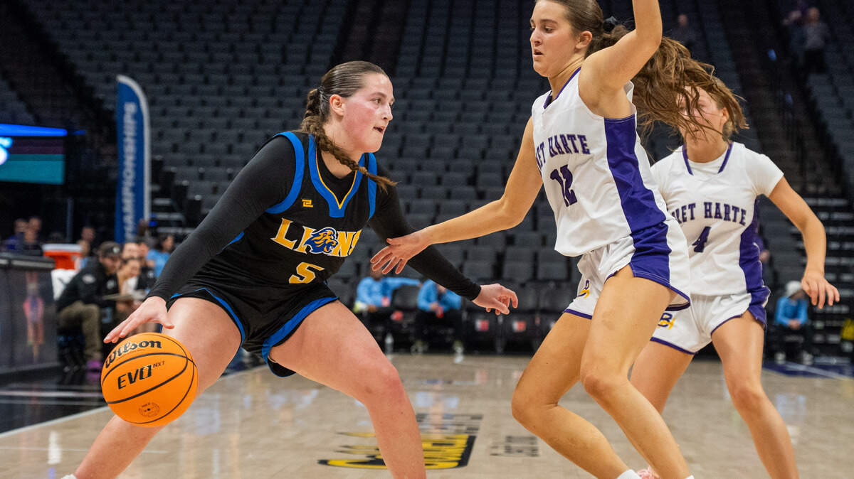 Faith Christian Lions guard Lauren Harris dribbles as the Bret Harte Bullfrogs’ Maddie Kane defends in the CiF Sac-Joaquin Section Division V girls basketball championship at Golden 1 Center on Saturday, Feb. 28. Harris scored 27 points in Tuesday’s CIF Northern California Division V girls basketball regional championship as the Lions will play for the CIF State Division V title on Saturday at Golden 1 Center.