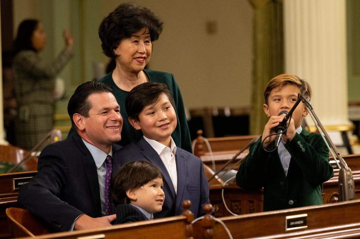 Assemblymember John Harabedian, D-Sierra Madre, sits with his family – Joseph, 3, Johnny, 10, Joshua, 6, and mother-in law Key-Hee Kim – before the start of the Assembly’s first meeting of the new legislative session at the state Capitol on Monday.