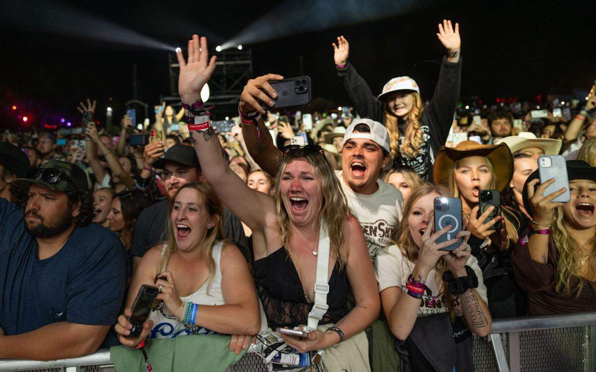 Fans at the GoldenSky Country Music Festival at Discovery Park in Sacramento get excited before Bailey Zimmerman’s set on Sunday, Oct. 20, 2024. 