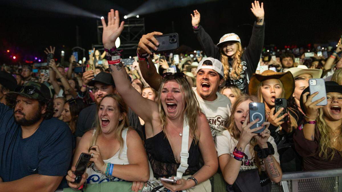 Fans at the GoldenSky Country Music Festival at Discovery Park in Sacramento get excited before Bailey Zimmerman’s set on Sunday, Oct. 20, 2024. 