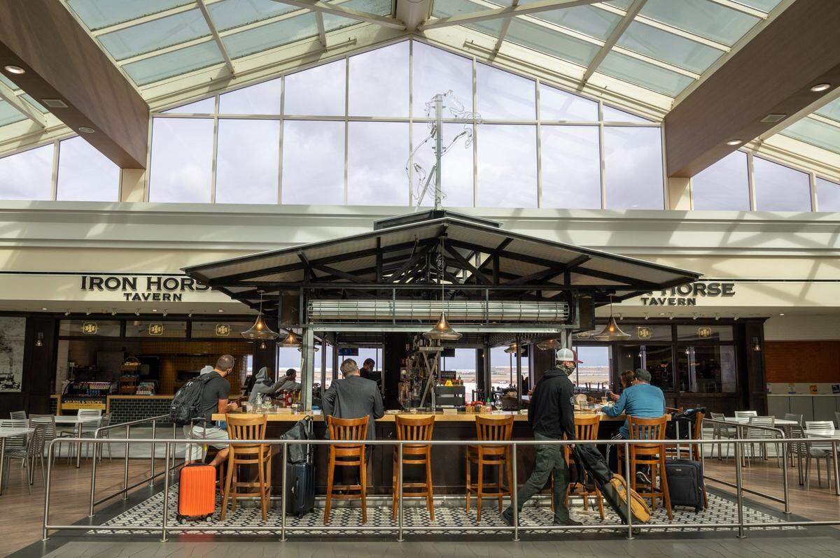 Customers eat at the Iron Horse Tavern in Terminal A at the Sacramento International Airport on Tuesday afternoon, Oct. 26, 2021. The only sit-down option in the terminal, it can struggle to meet demand during the lunch rush and it closes at 6 p.m.
