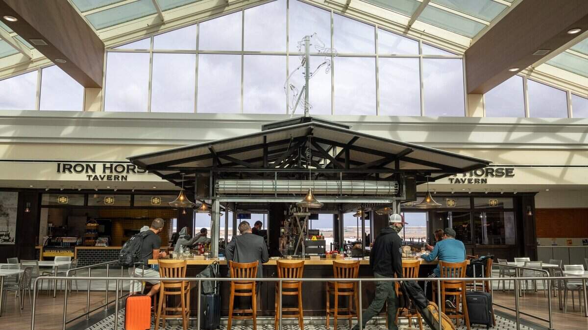 Customers eat at the Iron Horse Tavern in Terminal A at the Sacramento International Airport on Tuesday afternoon, Oct. 26, 2021.