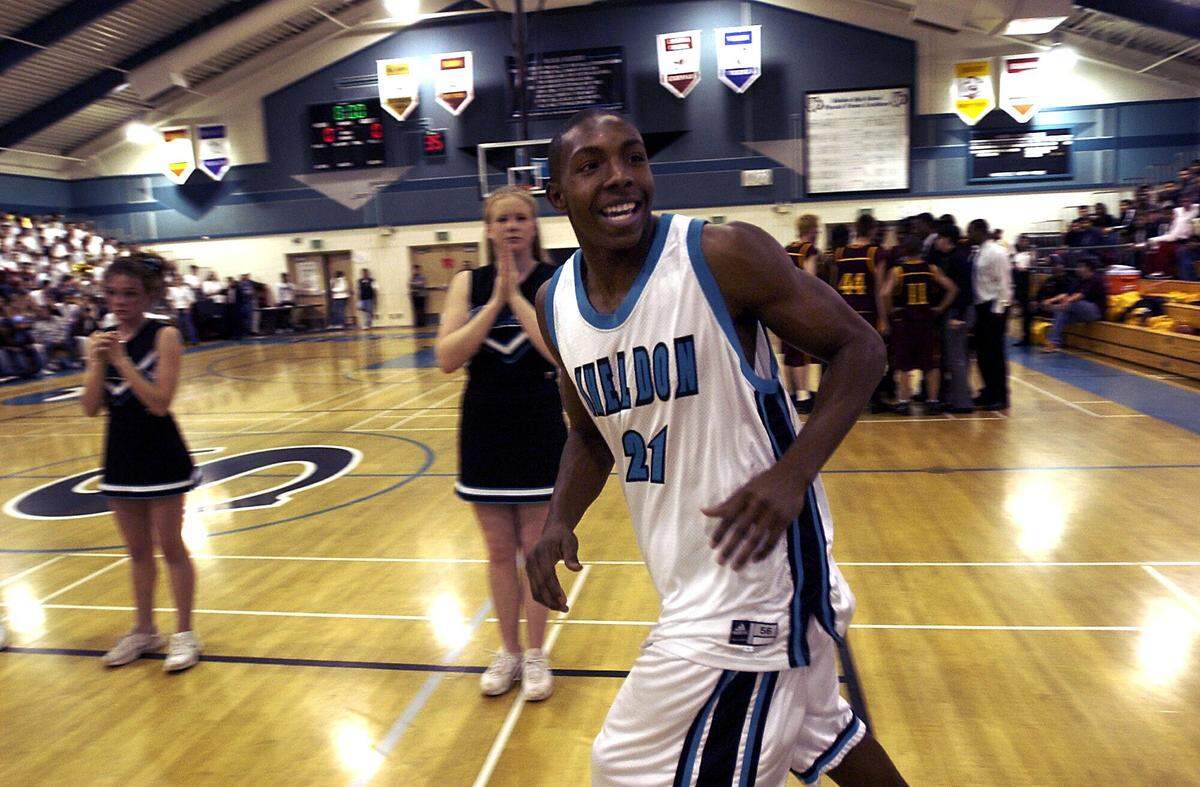 Sheldon High School basketball player DeMarcus Nelson is all smiles as he is introduced before the start of the game against Florin High School in his home gym on Jan. 20, 2004. Nelson remains the only Sacramento-area high school basketball player to reach the 3,000-point mark.