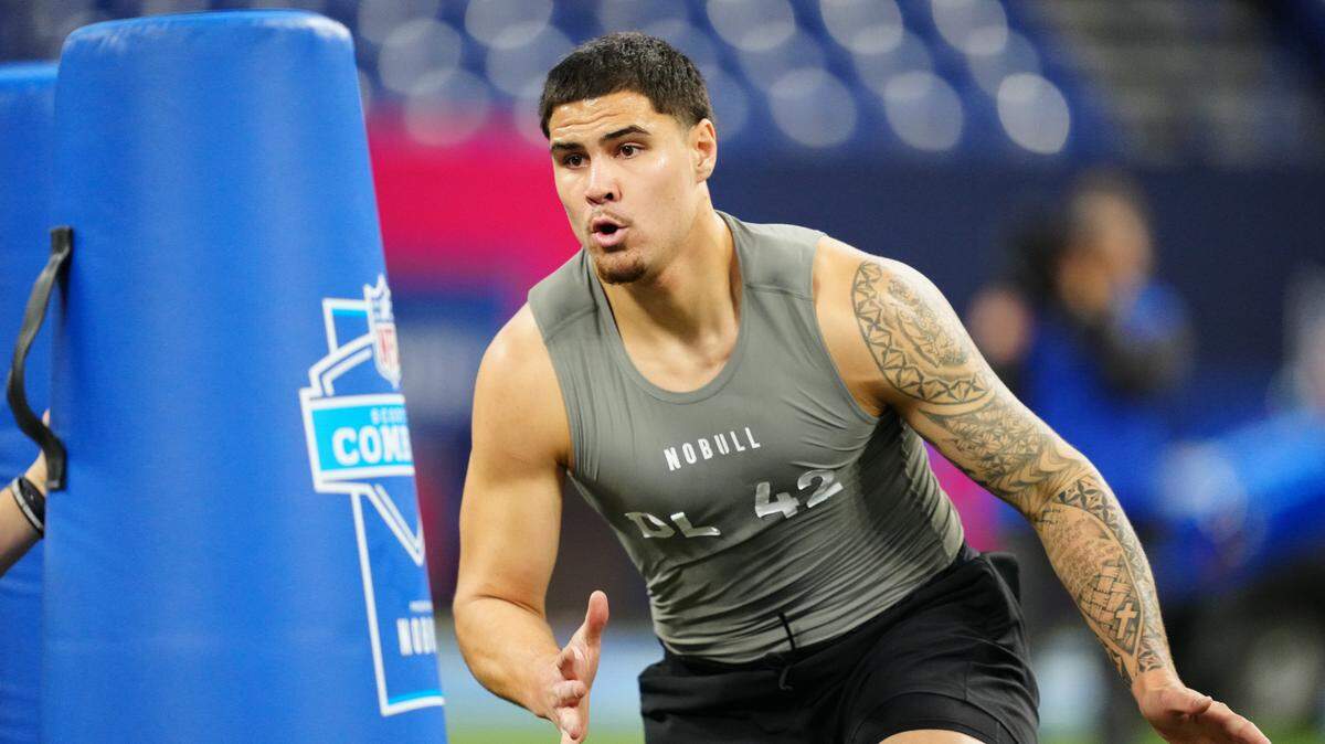 UCLA defensive lineman Laiatu Latu works out during the 2024 NFL Combine on Feb. 29 at Lucas Oil Stadium in Indianapolis.