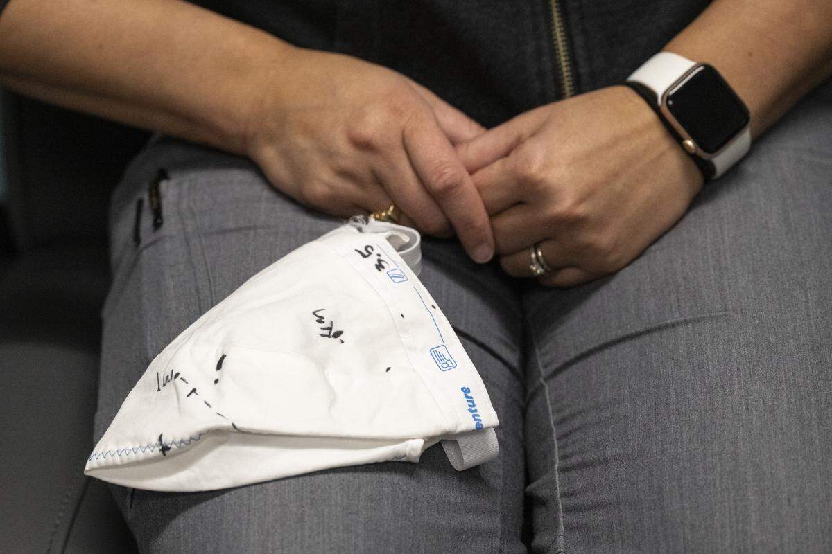 Brittany Chik, a registered nurse at Sutter Center for Psychiatry, holds a cap on Monday, Dec. 8, 2025, that patients will wear while undergoing the SAINT transcranial magnetic stimulation treatment at the Sutter Center for Psychiatry in Sacramento. The cap helps doctors identify the treatment site to deliver an electromagnetic stimulus to the brain.