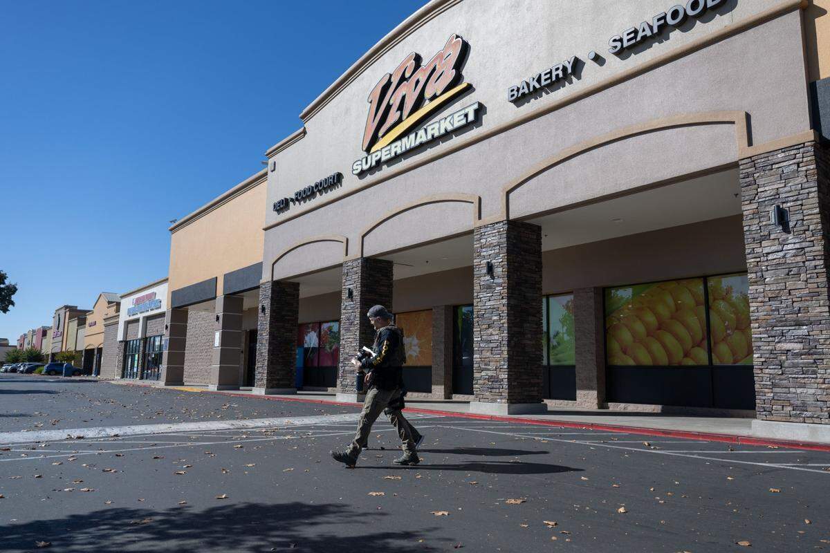 Homeland Security Investigations officers leave the Viva Supermarket on Folsom Boulevard in Rancho Cordova in October 2023 after federal agents temporarily closed the store, which is owned by Sacramento Councilman Sean Loloee.