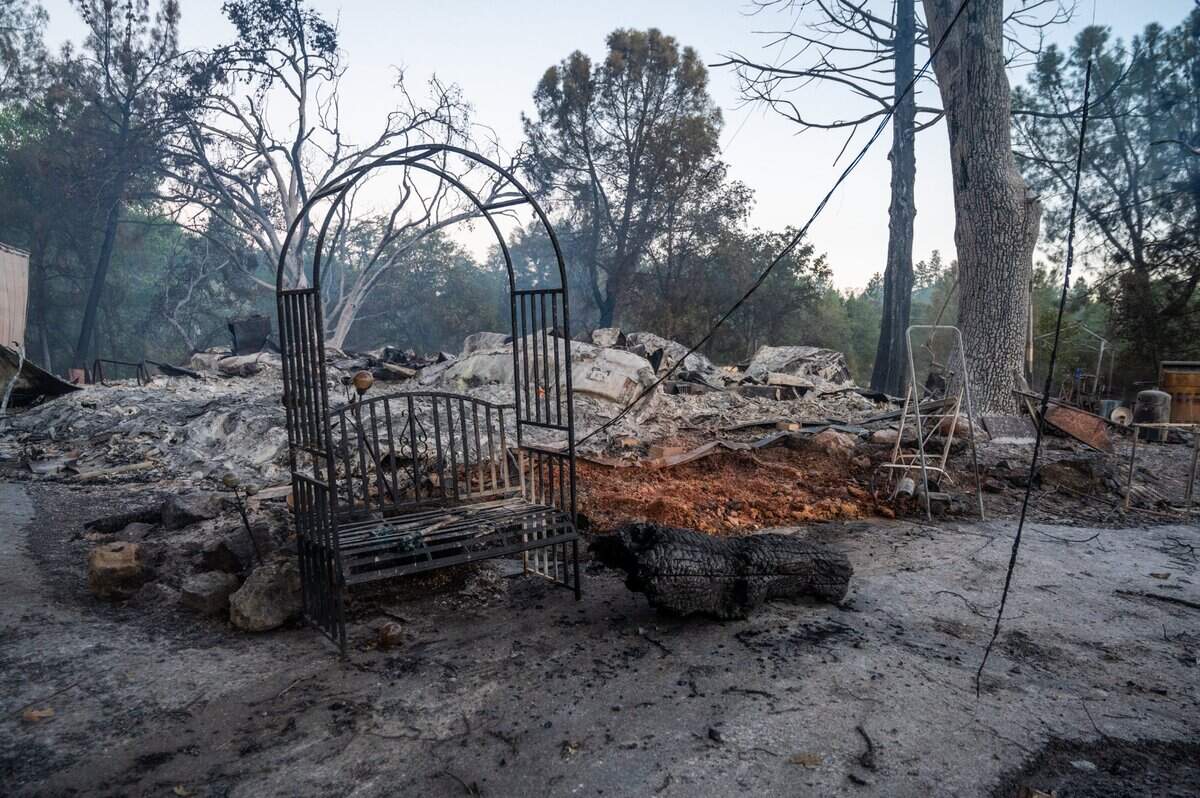 Rubble from a home lay on the ground during the River Fire on Mount Olive Road in Chicago Park on Thursday, Aug. 5, 2021.