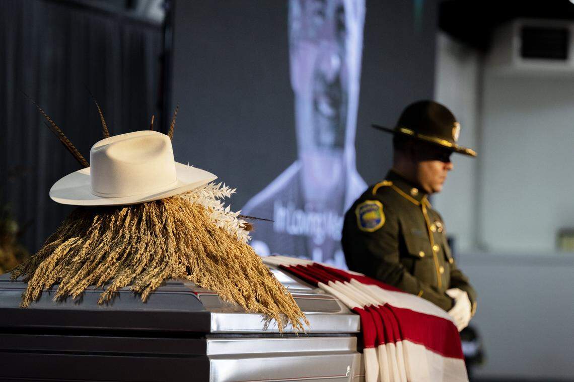Rice straw and a white cowboy hat sit on top of the casket of Rep. Doug LaMalfa duringa memorial service at the Silver Dollar Fairgrounds in Chico on Saturday.