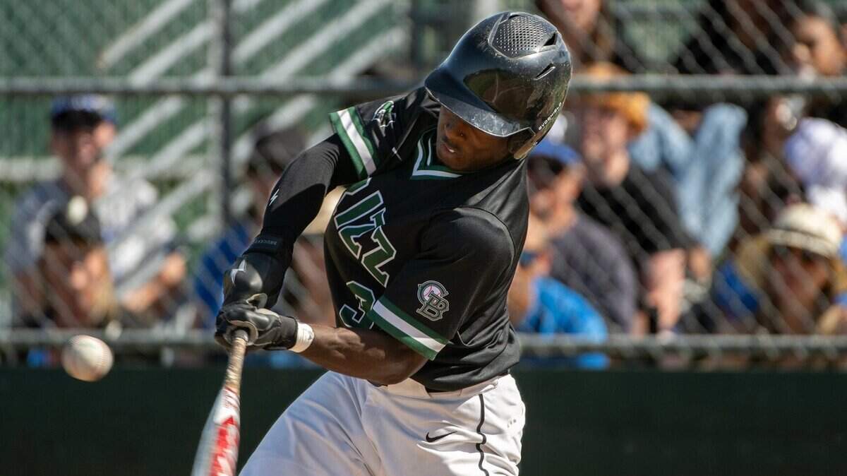 Granite Bay’s Tim Reed makes contact with a pitch against Rocklin on Thursday at Granite Bay High School.