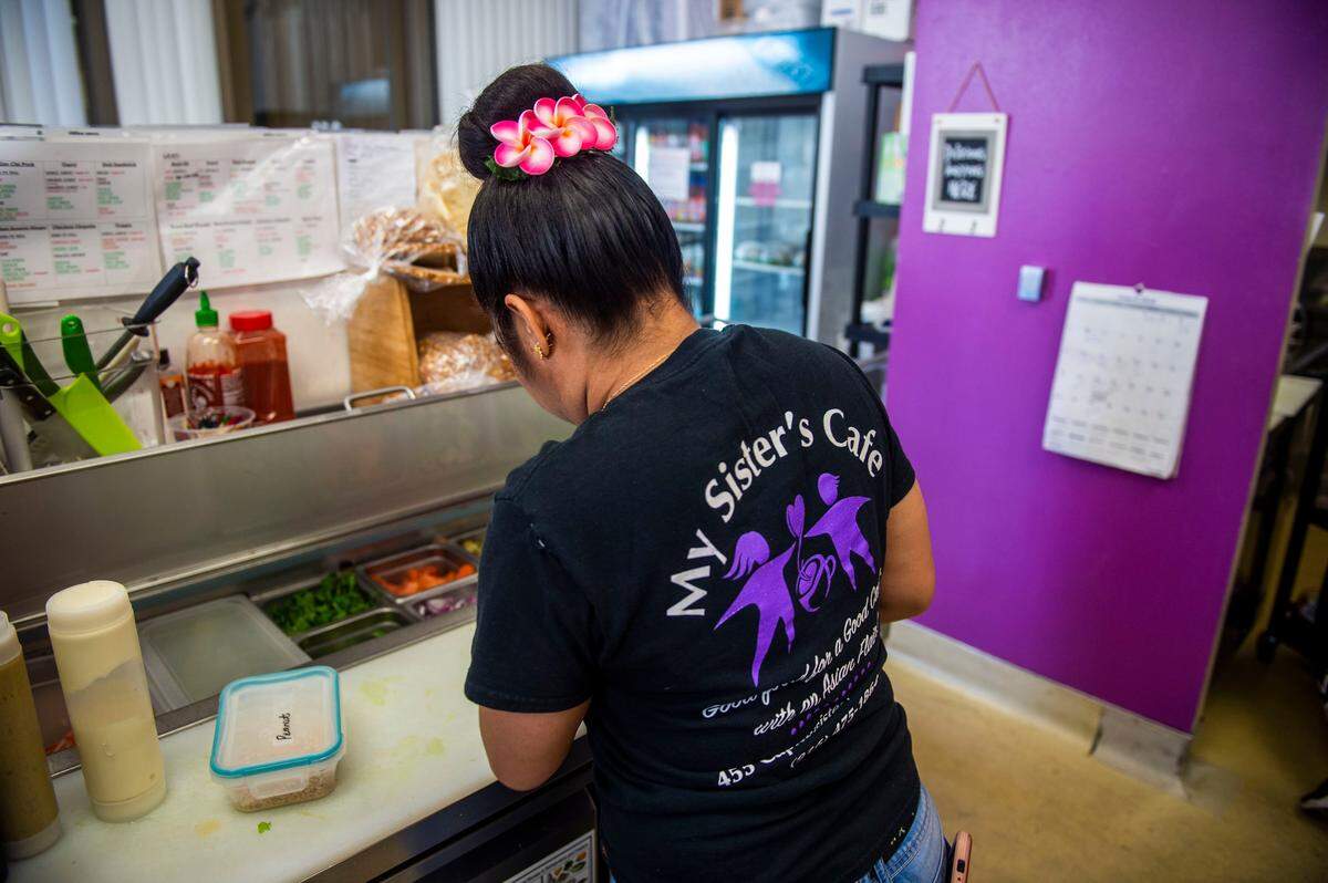An employee of My Sister’s Cafe makes a meal at their downtown location in Sacramento in 2019. The cafe helps fund My Sister’s House, a shelter for Asian and Pacific Islander women affected by domestic violence.