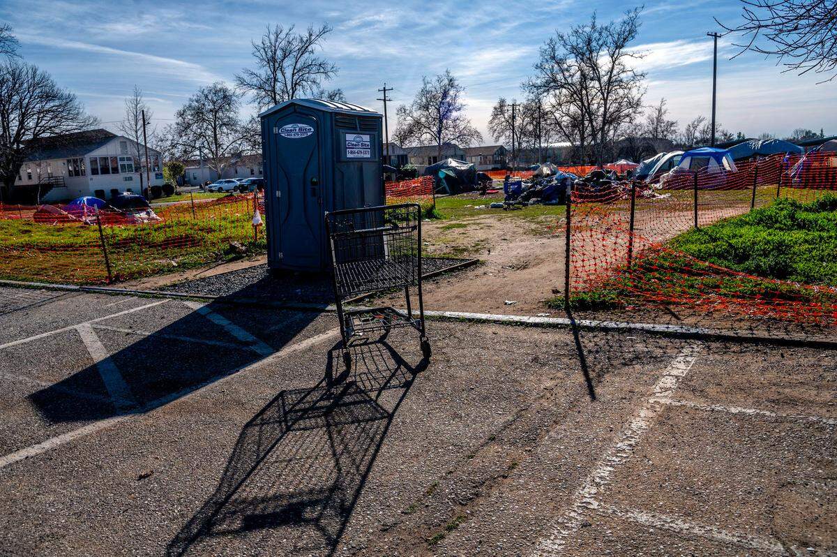 A homeless camp near the North Auburn government campus is stressing Placer County government employees. One resident of the camp said the orange construction fence made it feel like a concentration camp. Another complained they have a portable toilet but no running water.