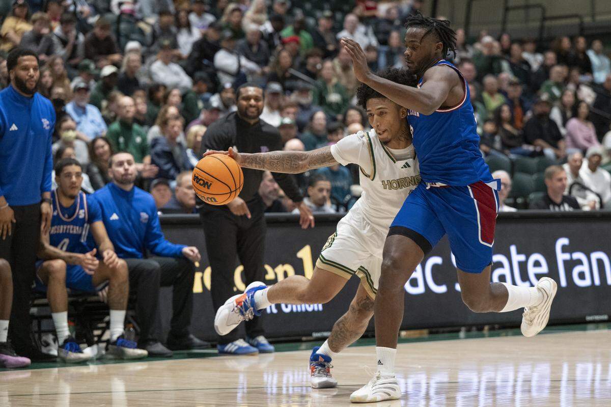 Sacramento State guard Mikey Williams (1) tries to move around the defense during a game between Sac State and Presbyterian at Hornet Pavilion in Sacramento on Sunday, Nov. 16, 2025.