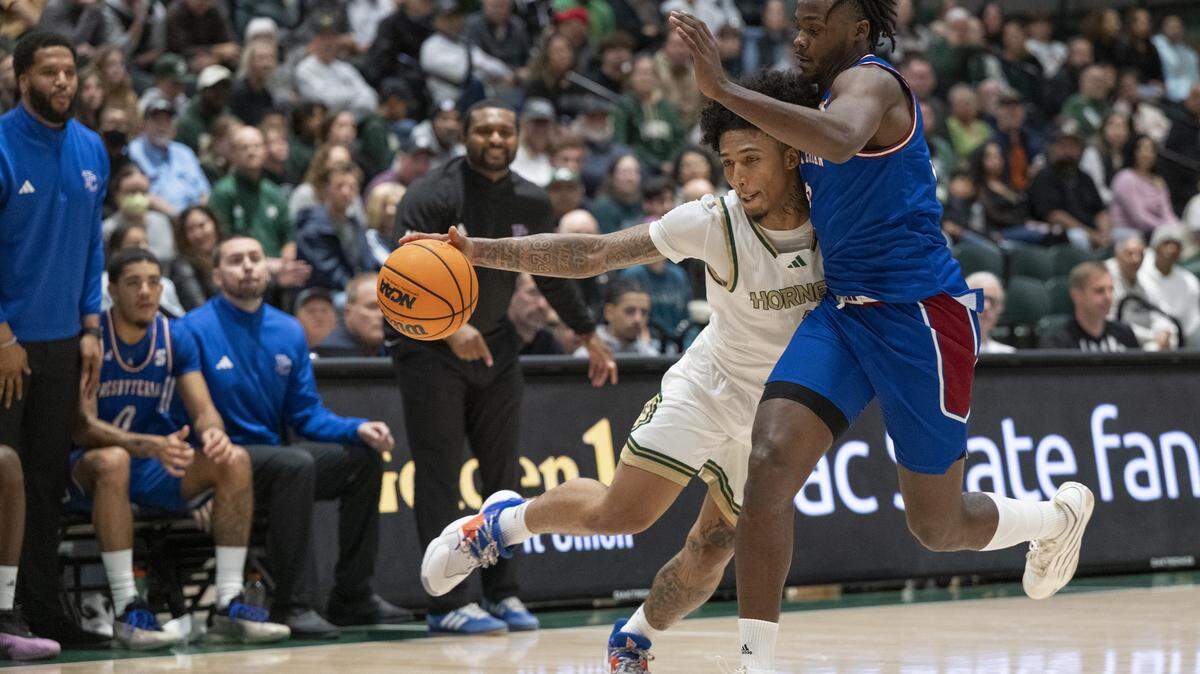 Sacramento State guard Mikey Williams tries to move around the defense during a game between Sac State and Presbyterian at Hornet Pavilion in Sacramento on Sunday, Nov. 16.