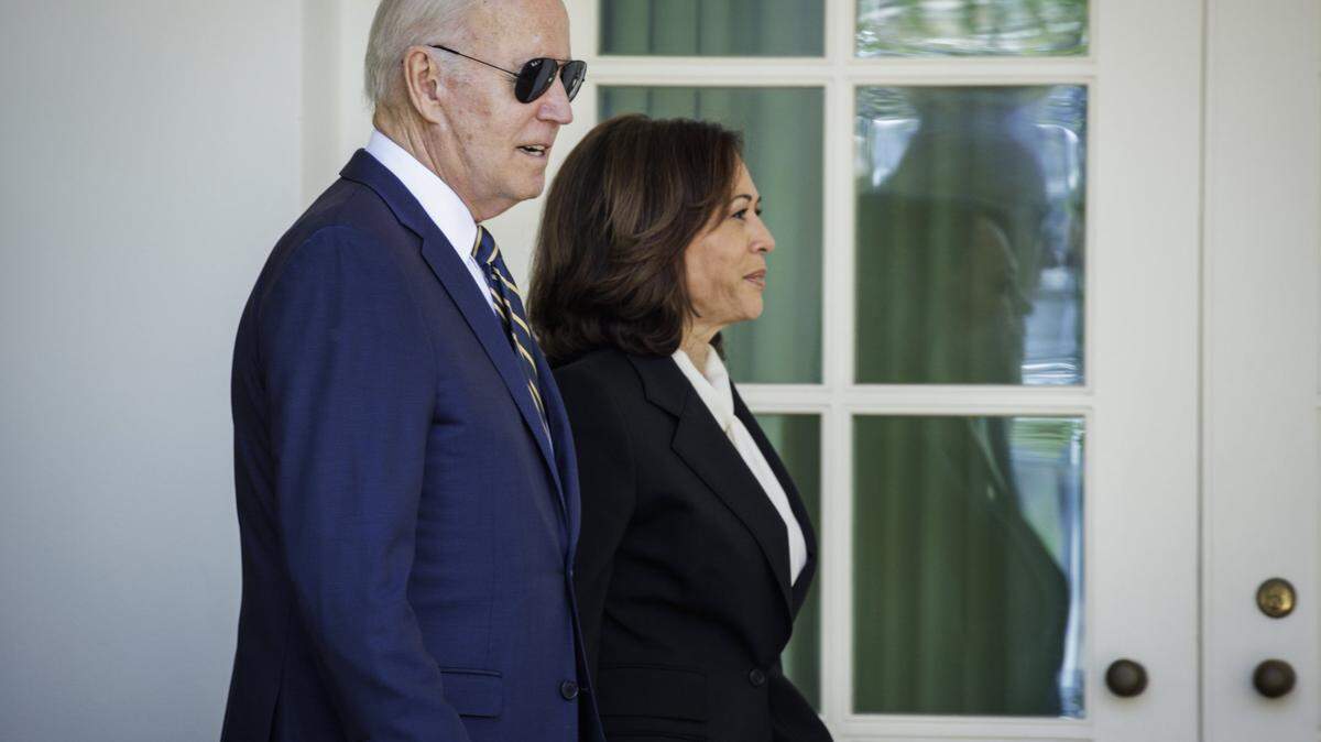 President Joe Biden walks with Vice President Kamala Harris
