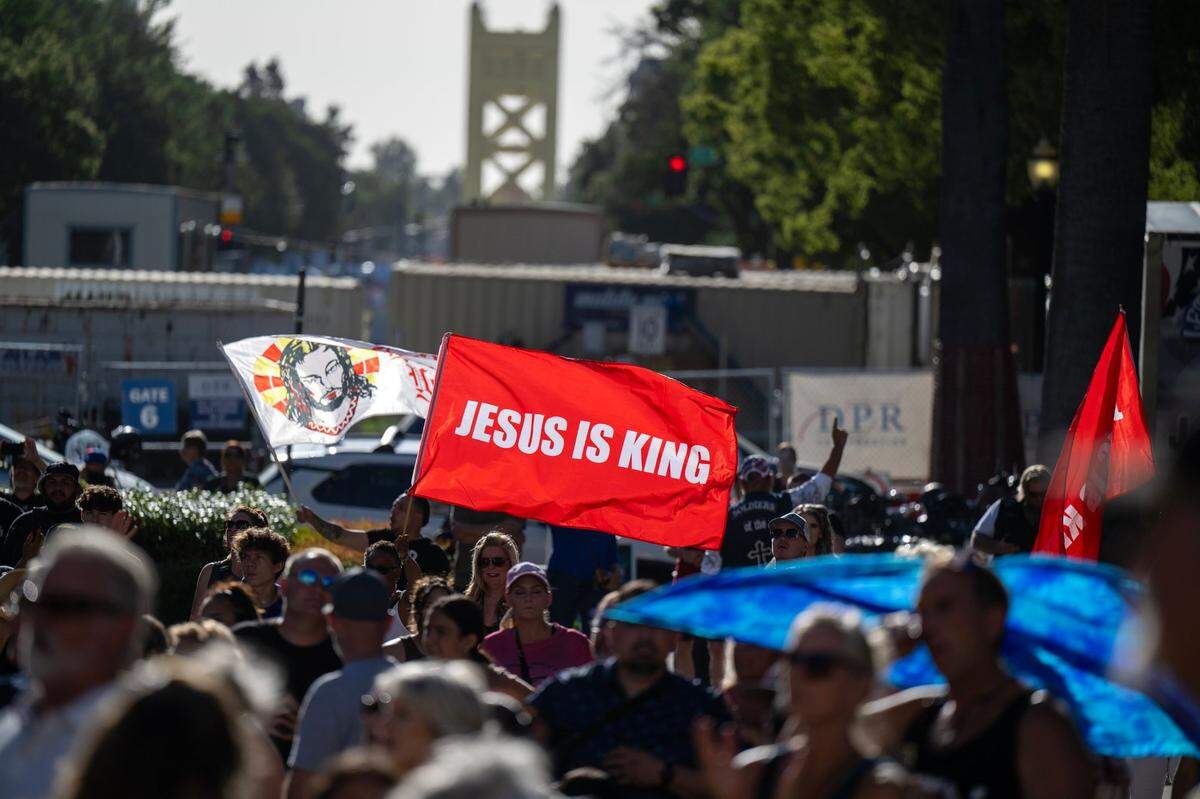 Jesus flags wave during the Let Us Worship rally at the state Capitol on Saturday.