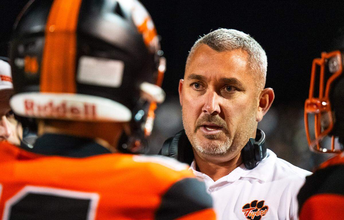 Roseville coach Adam Reinking speaks with players before the second half against the Nevada Union Miners on Friday.