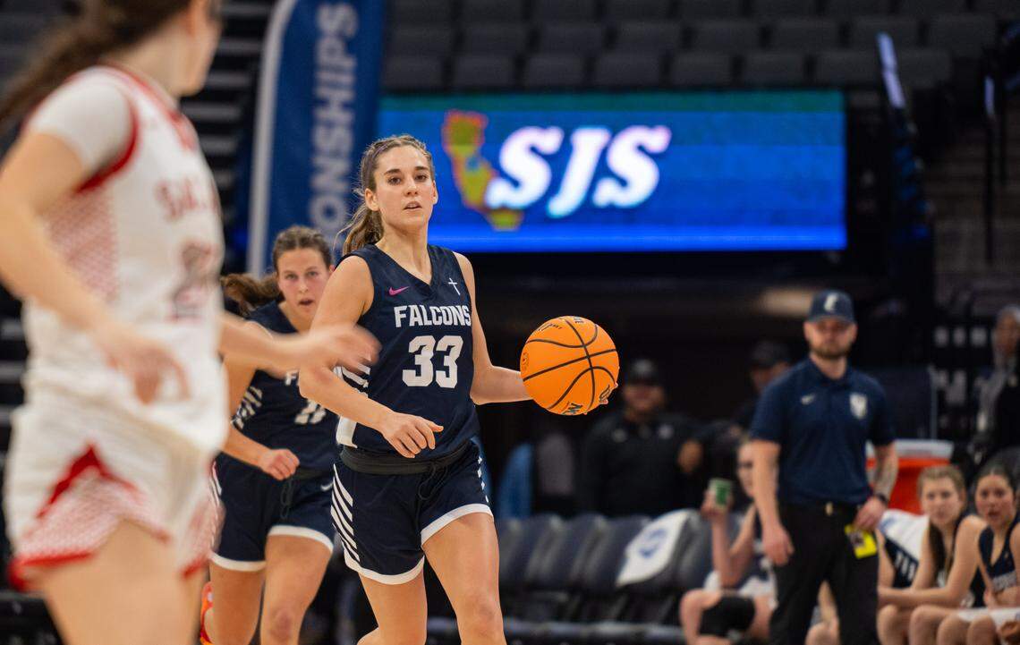 The Forest Lake Christian Falcons’ Abbie Stokes brings the ball up court against the Sacramento Adventist Capitals in the CIF Sac-Joaquin Section Division VI girls basketball championship on Friday at Golden 1 Center. 