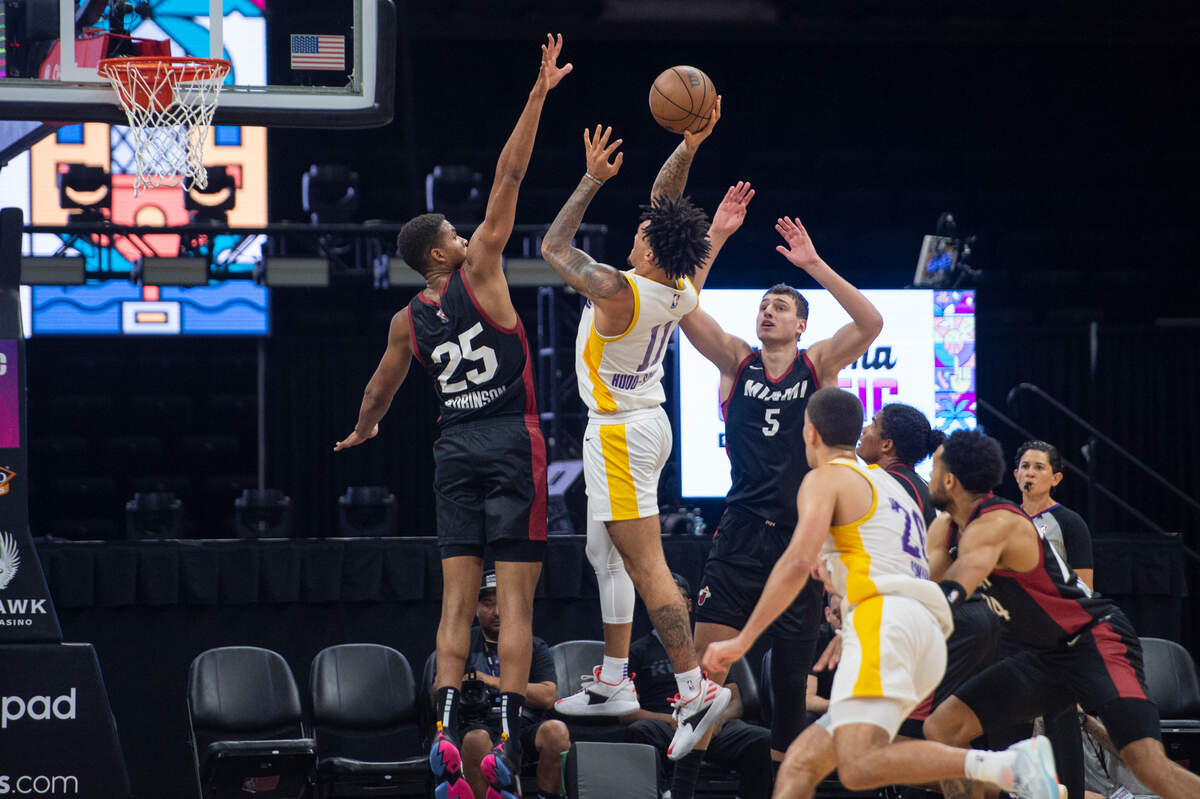 Los Angeles Lakers Jalen Hood-Schifino (11) goes up for a layup against Miami Heat Orlando Robinson (25) in the first half of the California Classic on Monday, July 3, 2023, at Golden 1 Center.